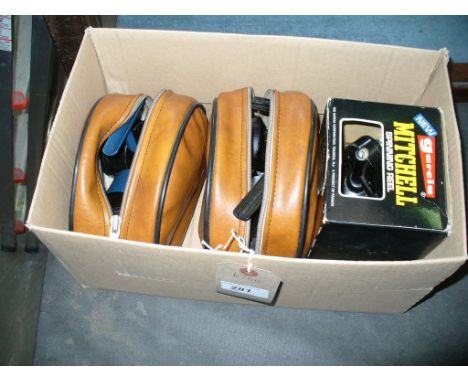 A Cased Abu 506 spinning reel , a  second similar reel , a boxed Mitchell spinning reel and 2 others. ( 5 )