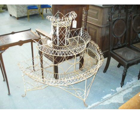 A painted wirework conservatory planter late 19th / 20th Century
Of scrollwork design with three half-moon tiers, each with w