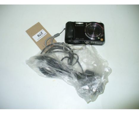 A Panasonic lumix  DMC - TZ30 digital camera and charger.