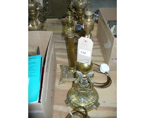 A Brass Corinthian column table lamp with a square scrolling leaf open work base and a second brass column table lamp with a 