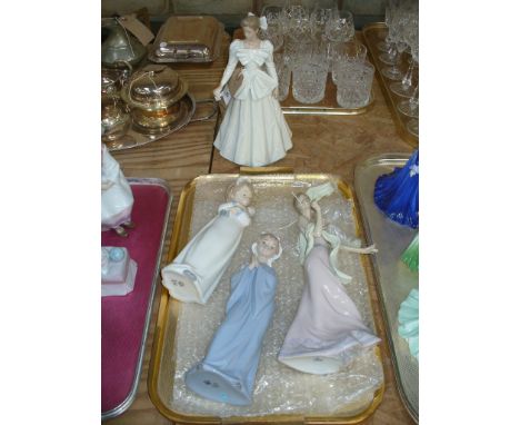 A Nao model of a girl holding a doll, a Nao model of a girl praying and 2 others.( 4 )