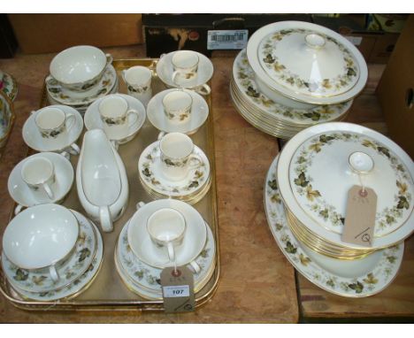 A Royal Doulton " Larchmont " tea and dinner service comprising 2 tureens , dinner plates, coffee cups and saucers, etc.