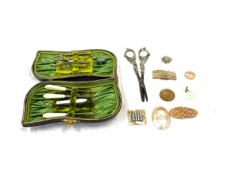 Pair of Vintage grape scissors, cased manicure/ sewing set and a selection of vintage Mother of pearl buckles 