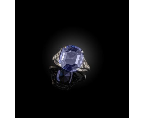 An early 20th century colour-change sapphire and diamond ring, the step-cut sapphire claw-set within pierced diamond-set shou