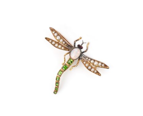 A gem-set brooch, circa 1900, designed as a dragonfly, its thorax set with an opal, its abodomen set with step-cut demantoid 