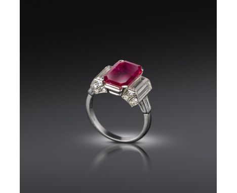 Cartier, an Art Deco ruby and diamond ring, C1935, the emerald-cut ruby measuring 13.04 x 8.10 x 3.95mm which calculates to a