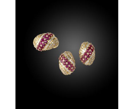 A pair of ruby and diamond bombe earrings, set with a diagonal pairs of rubies within pave-set diamond surround in yellow gol