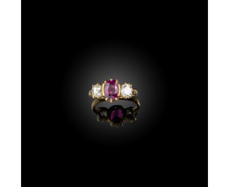 A ruby and diamond ring, claw-set with an oval ruby between cushion-shaped diamond shoulders, mounted in gold, size J, case