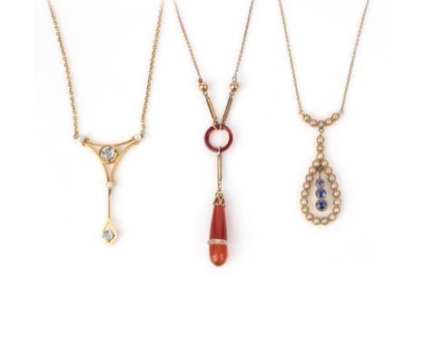 A collection of three gold and gem-set pendant necklaces, early 20th century, comprising: one pendant set with a ring and dro