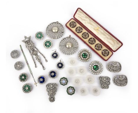A large group of paste jewels, 19th and early 20th century, comprising: three brooches and a button, each in green and colour