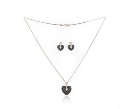 A black diamond demi-parure, comprising: a pendant neckalce and a pair of earrings, each designed as a heart and arrow set wi