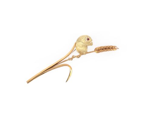 E Wolfe and co, A large 18 carat yellow gold brooch depicting a field mouse, set with a ruby eye and diamond highlights. Lond