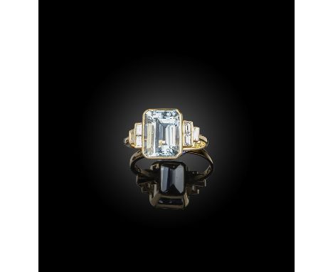 An aquamarine and diamond ring, the step-cut aquamarine with baguette-shaped diamond shoulders in yellow gold, size N 1/2