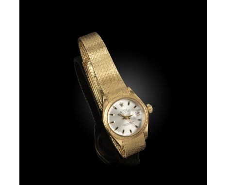 Rolex, a lady's gold Datejust wristwatch, the signed silver dial with baton numerals, date aperture, sweep seconds hand, auto