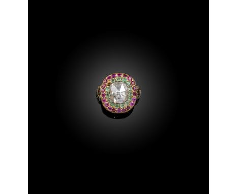 A George III ruby, emerald and diamond ring, set with a central rose-cut diamond within borders of emeralds and rubies in clo