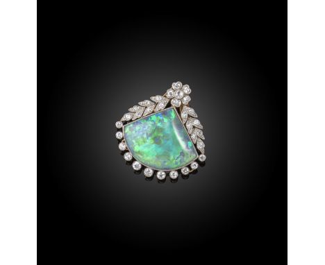 An early 20th century opal and diamond clip brooch, the fan-shaped solid opal millegrain-set beneath a border of diamonds and