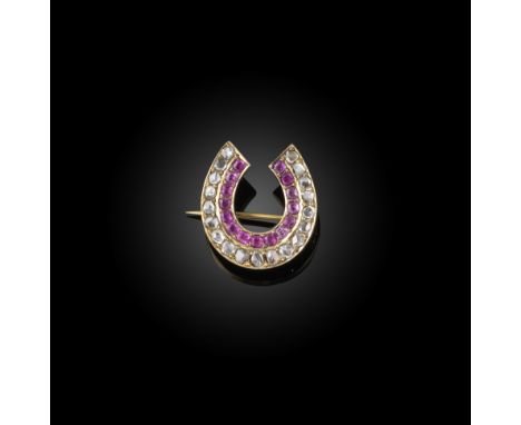 A late 19th century ruby and diamond horseshoe brooch, set with a row of rubies within a row of diamonds in closed-back yello