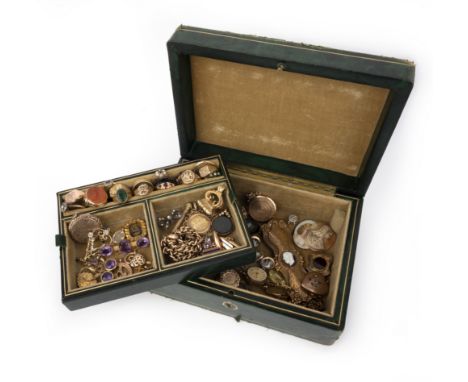 A jewellery box containing a collection of jewellery, comprising: a sapphire and diamond cluster ring; a ruby and diamond thr