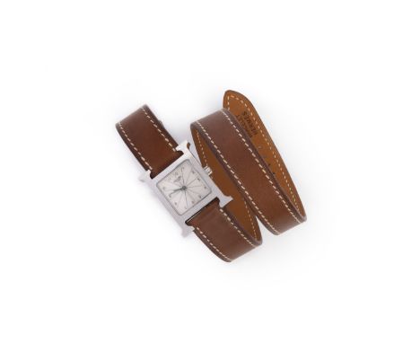 Hermès, a lady's steel Heure H wristwatch, small model, the steel watch with signed dial, quartz movement and long interchang