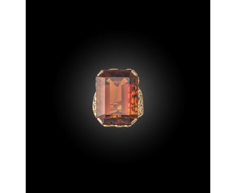 A French gold citrine ring, the step-cut orange citrine set in pierced wirework yellow gold mount, French control marks and m