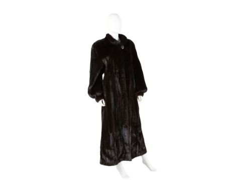 Full length long black mink fur coat with brown undertones. With a satin-lined interior printed throughout with leaves. With 