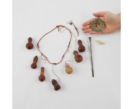 Group of four Chinese dressing items including: a necklace of dwarf gourds with a broken string, a glass bird pendant with ma