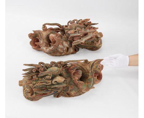 Pair of Qing dynasty polychromed wooden architectural roof carvings depicting dragon fish, a temple component with the wish o