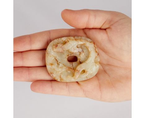 Antique Chinese jade bi carving depicting a serpentine dragon. Semi-translucent off-white coloration with russet inclusions.H
