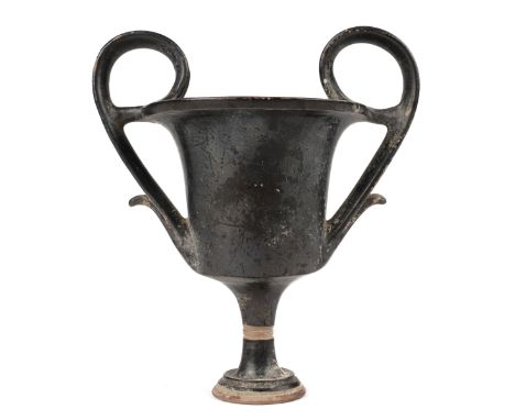 Greek Apulian blackware kantharos with a stemmed foot and goblet-formed cup and large looping handles, ca. 350 B.C.E. This wa