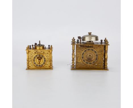 Group of two Japanese brass table or pillow clocks, likely Makura Dokei. Each hour marked along the dial. With ornate scrolli