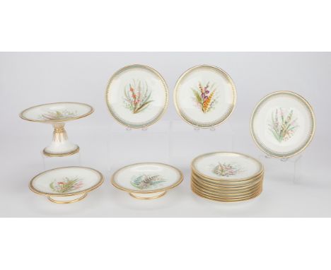 Royal Worcester, England. Group of hand-painted fine bone china including 12 plates, two low tazzas, and one tall tazza. Each