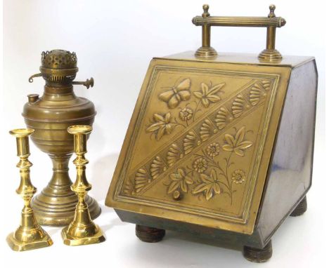 A Victorian brass coal scuttle, Brass oil lamp base and a pair of brass candlesticks Unfortunately we cannot do condition rep