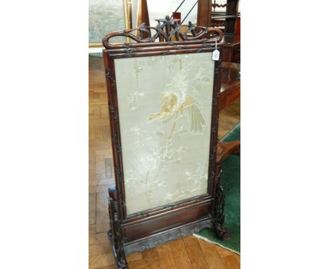 Chinese carved hardwood firescreen, with carved bamboo decoration and open fretwork design enclosing a silk needlework panel 
