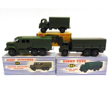 THREE DINKY MODEL MILITARY VEHICLES  comprising a No.689, Medium Artillery Tractor, olive drab with matching grooved hubs, ex