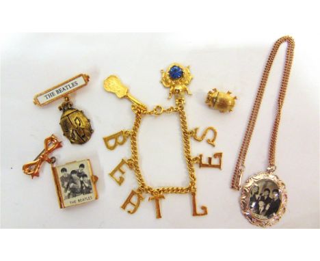 THE BEATLES - ASSORTED FASHION JEWELLERY  comprising a gilt metal letter bracelet; a bow brooch with suspended book of concer