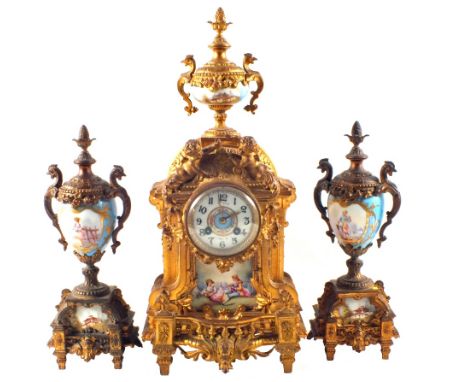 A 19th Century French gilt metal clock garniture, the clock with cherub and face decoration, figure painted porcelain panel, 