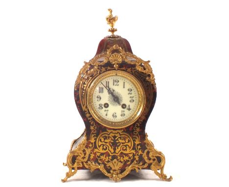 A French Boulle striking mantel clock in waisted case