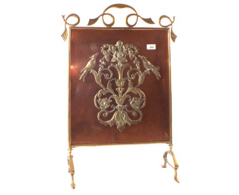 An Art Nouveau Copper and Brass firescreen with applied foliage and bird decoration