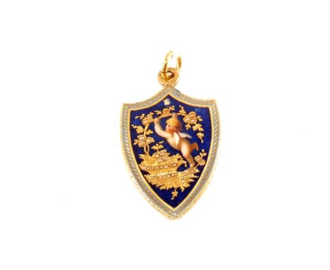 An unmarked Gold shield shaped pendant with blue enamel decoration depicting a cherub with a basket of flowers set with Seed 