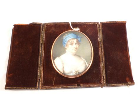 A 19th Century portrait miniature of head and shoulders of a lady in an oval gilt frame