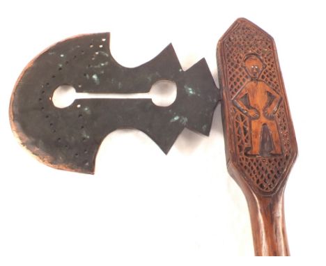 A West African tribal axe with pierced blade and figure carving