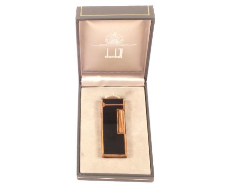 A cased Dunhill gilt and black enamel lighter in original box