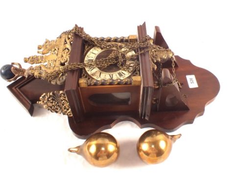 A reproduction wall clock with Brass fittings