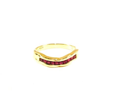 A square cut Ruby set ring stamped 750, size L