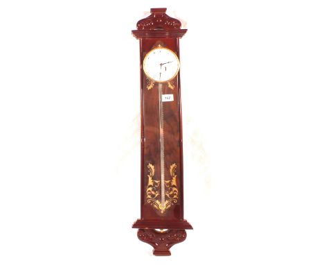 A reproduction Mahogany saw clock
