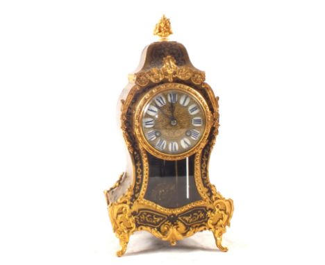 A French Boulle mantel clock in waisted case, enamel dial, blue numerals and sunburst pendulum