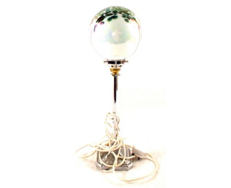 An Art Deco style chrome lamp with iridescent green glass shade