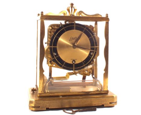 A German Schatz Brass four glass clock