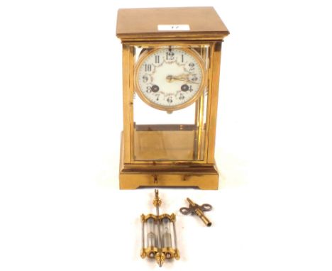 A Brass four glass mantel clock with painted enamel dial and mercury pendulum