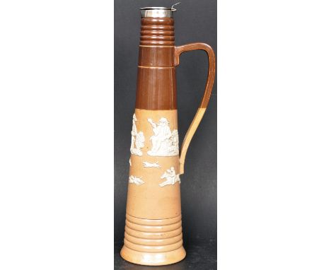 A 19th century Victorian Doulton Lambeth ewer jug of tapering form having applied ceramic decoration in relief and hallmarked